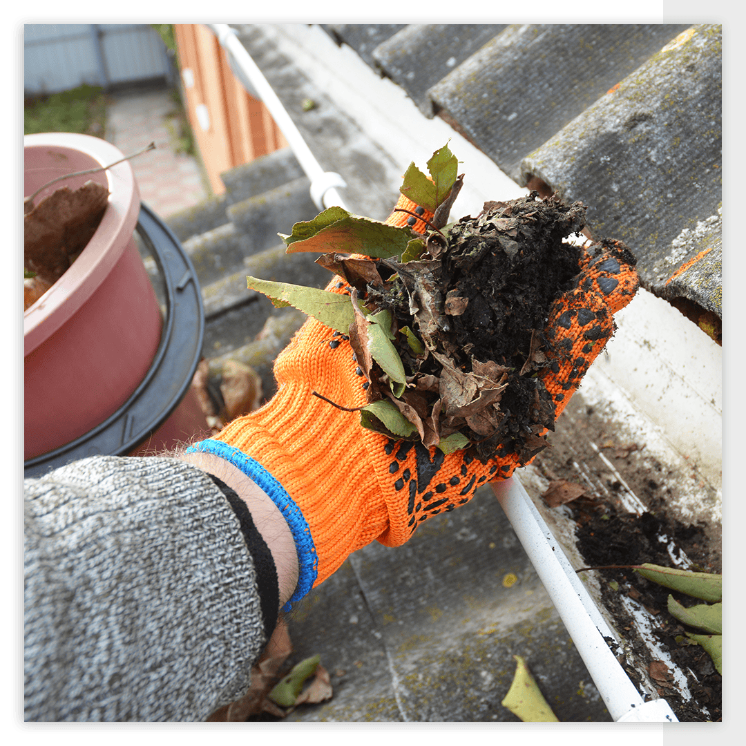 removing debris from gutter